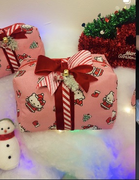 Reusable fabric gift wrap arranged with ribbon